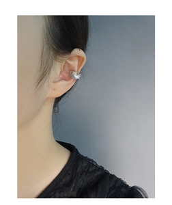 Detailed view of S925 sterling silver ear cuff with irregular textured lava design
