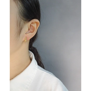 Minimalist gold croissant hoop earrings shown on model for a sophisticated look