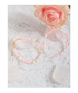 Detail of S925 silver tag on pink baroque pearl and shell bead bracelet for women