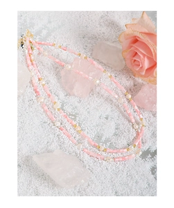 Detailed close-up of pink beaded necklace with baroque pearls and S925 silver accents