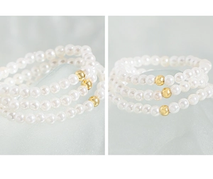 Three-piece stackable beaded bracelet set with white faux pearls and gold metal accent beads