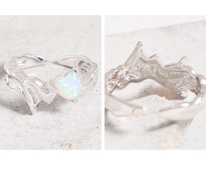 Detailed macro view of S925 sterling silver heart opal ring with lava texture and hallmark