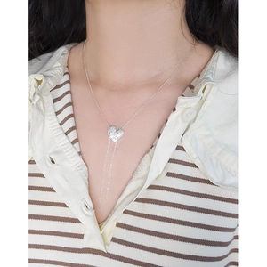 Elegant S925 sterling silver heart necklace with tassel fringe on female model