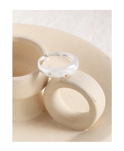 Macro detail of S925 sterling silver ring featuring star and moon engravings with zircons