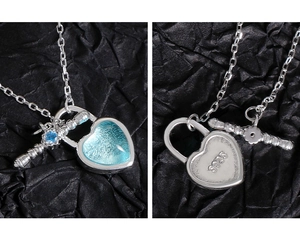Macro view of S925 sterling silver stamp and blue heart locket on the pendant back