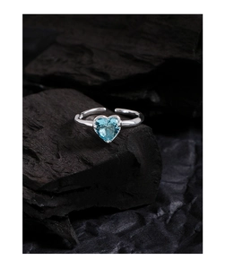 Close-up of heart-shaped blue gemstone on S925 sterling silver adjustable open ring