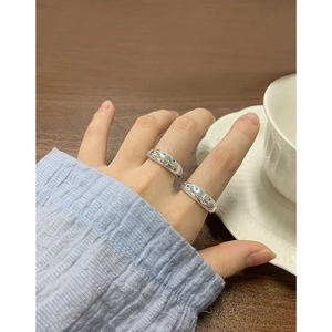 S925 sterling silver rings with colorful zircon inlays worn on a wooden table setup