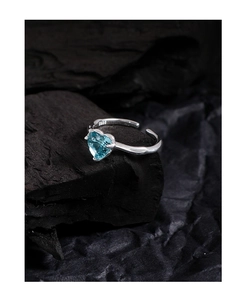 Macro shot of S925 sterling silver ring with heart-shaped light blue gemstone