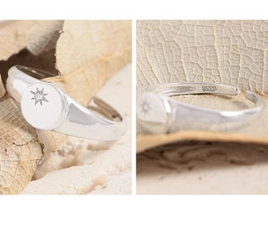 Detailed macro shot of S925 sterling silver hallmark and moon star zircon inlay on ring