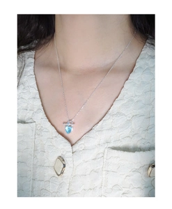 Close-up of S925 silver necklace featuring a blue heart pendant and unique OT clasp toggle