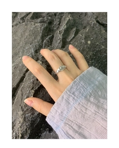 Detail of S925 sterling silver ring featuring a starburst engraving on a round seal
