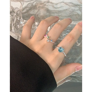 Minimalist S925 sterling silver ring featuring a light blue heart-shaped stone and colorful zircons