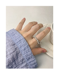 Detailed view of S925 silver ring with sparkling cubic zirconia and four aligned pearls