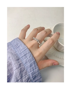 Detail of S925 silver ring featuring layered design with pearls and zircon stones