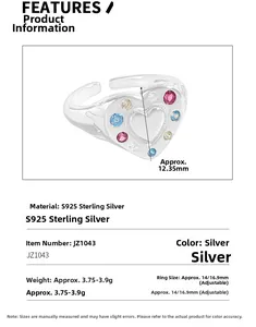 Macro detail of S925 sterling silver heart ring showing colorful zircon inlay and specs