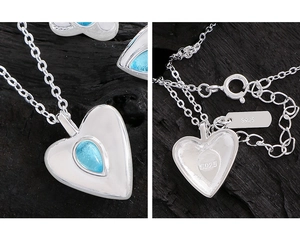 Macro detail of S925 sterling silver stamp on blue heart crystal necklace pendant