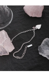 Detail shot of S925 sterling silver heart bracelet with a pink crystal bead