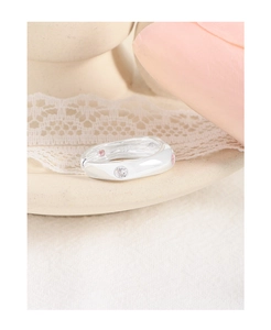 Macro view of S925 sterling silver ring with inlaid pink and white zircon stones