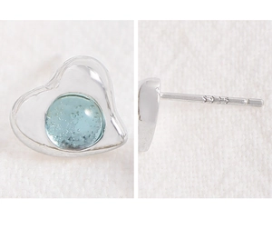 Detailed close-up of S925 sterling silver stamp on light blue heart crystal earrings