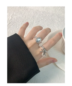 Macro shot of S925 silver irregular crystal ring with moonlight stone and pearl tassels