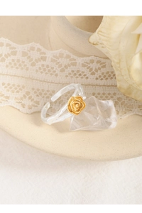 Close-up of S925 sterling silver ring featuring a detailed golden rose flower design