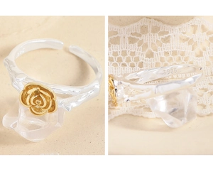 Detail view of S925 silver stamp and two-tone rose flower on adjustable ring