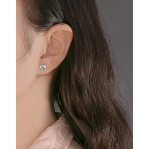 Elegant S925 sterling silver heart stud earring with crystal inlay on a model ear