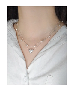 Vue rapprochée du collier double rang en argent S925 avec pendentif cœur 3D bombé