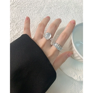 Irregular S925 silver rings with oval crystal stone and textured wavy band on hand