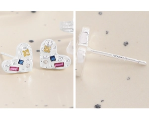 Detail of S925 sterling silver heart earrings with colorful zircon stones and texture