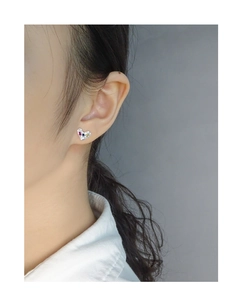 Close-up of model wearing S925 silver heart stud earrings with colorful zircon stones