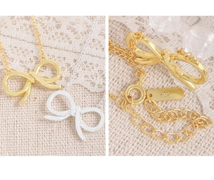 Detailed macro view of S925 sterling silver stamp and adjustable clasp on the bow necklace