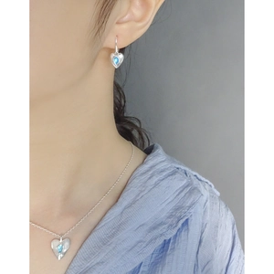 S925 sterling silver heart jewelry set with blue opal gemstones worn by a model