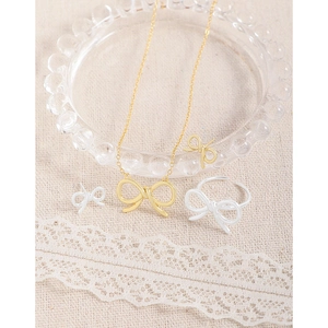 S925 sterling silver bow jewelry set with gold necklace, ring, and stud earrings