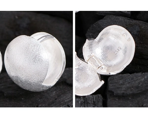 Detailed macro view showing S925 hallmark on the brushed silver ball stud earrings