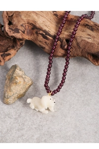 Close-up of S925 silver beaded necklace with purple garnet and cream puppy pendant