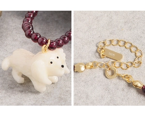 Detail showing S925 sterling silver lobster clasp and carved puppy stone pendant