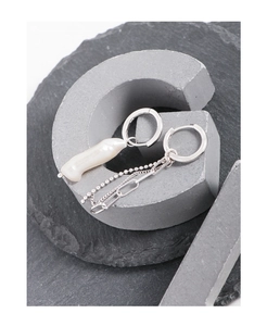 Detail of asymmetric S925 silver earrings with baroque pearl and layered fringe chains