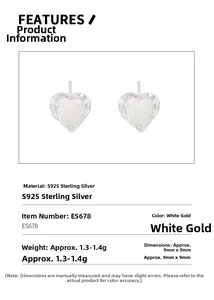 Detail view of heart-shaped S925 sterling silver earrings with white gemstone inlay