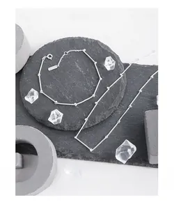 Vue détaillée de l'ensemble collier et bracelet en argent S925 à maillons bambou épurés