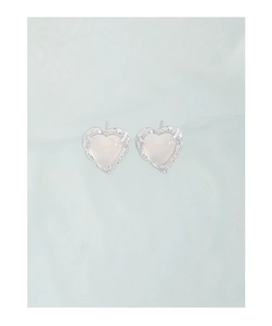 Detail shot of S925 silver heart earrings with lava texture and moonstone center