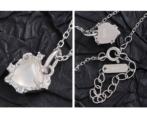 Detail of S925 sterling silver heart necklace with moonstone and cubic zirconia stones