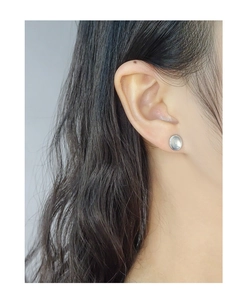 Detail of S925 sterling silver oval stud earrings featuring a blue agate stone inlay