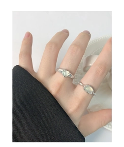 Close-up of S925 silver ring with green oval agate and heart stone on hand