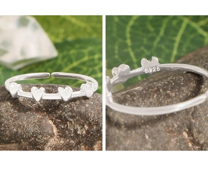 Macro view of S925 sterling silver stamp on the adjustable minimalist heart ring band