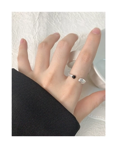 Detailed view of S925 sterling silver U-shaped ring with black onyx on model hand