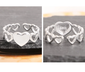 Detailed view of S925 sterling silver heart ring with cutout chain design and hallmarked stamp