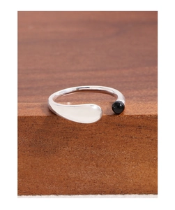 Macro view of S925 sterling silver U-shaped ring featuring a polished black agate bead inlay