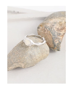 Macro detail of S925 sterling silver ring showing inner stamp and cream oval agate stone