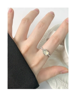 Detail of S925 sterling silver ring featuring oval agate and textured vintage design